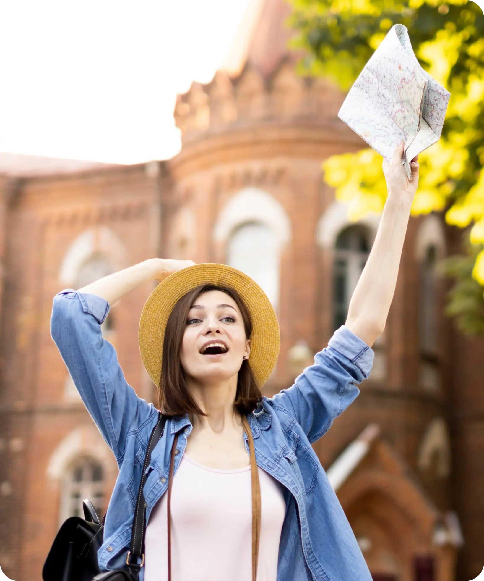 Happy woman in graduation cap celebrating